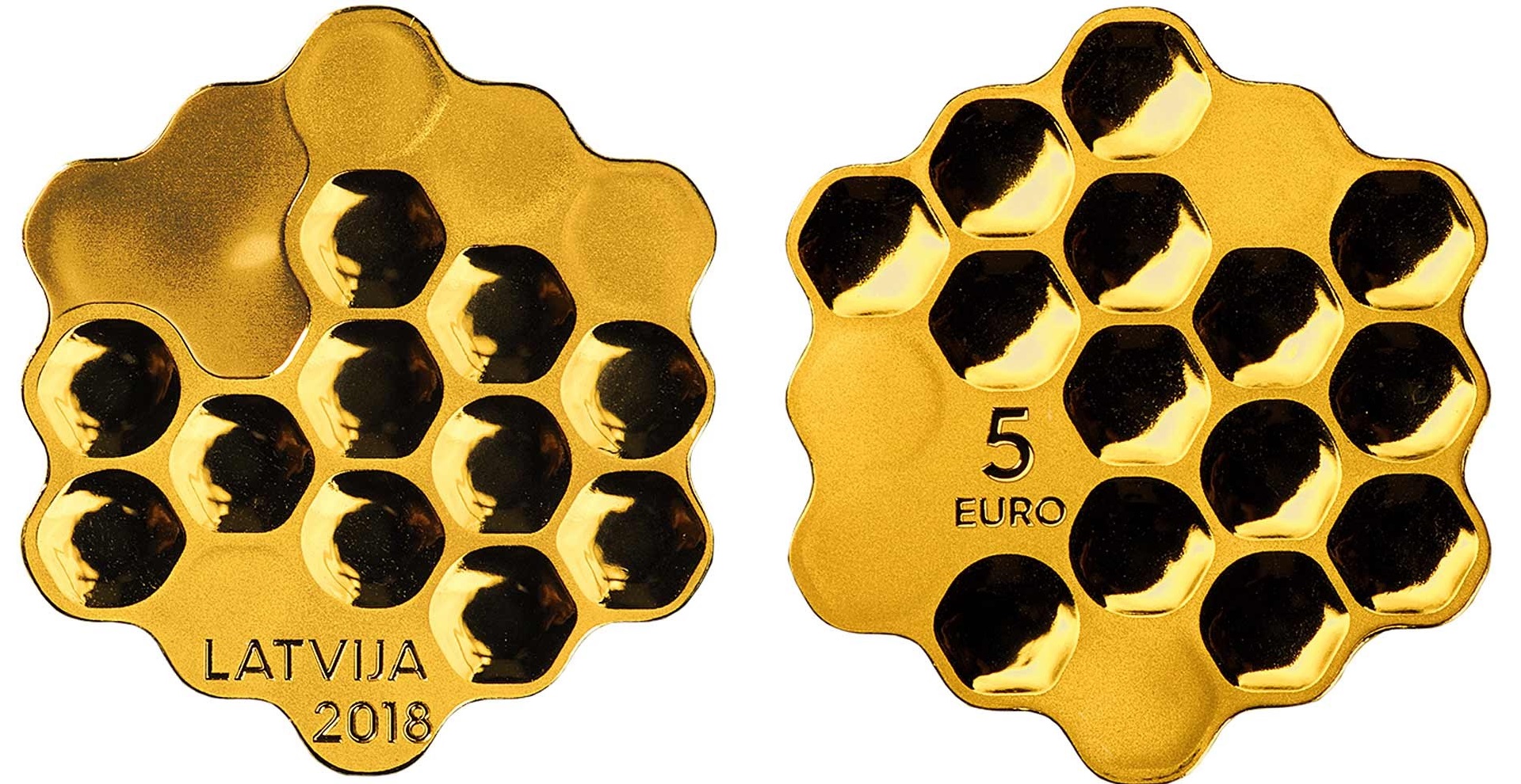 Ecco la bella moneta-alveare dal profilo esagonale emessa dalla Lettonia per il secolo della prima indipendenza