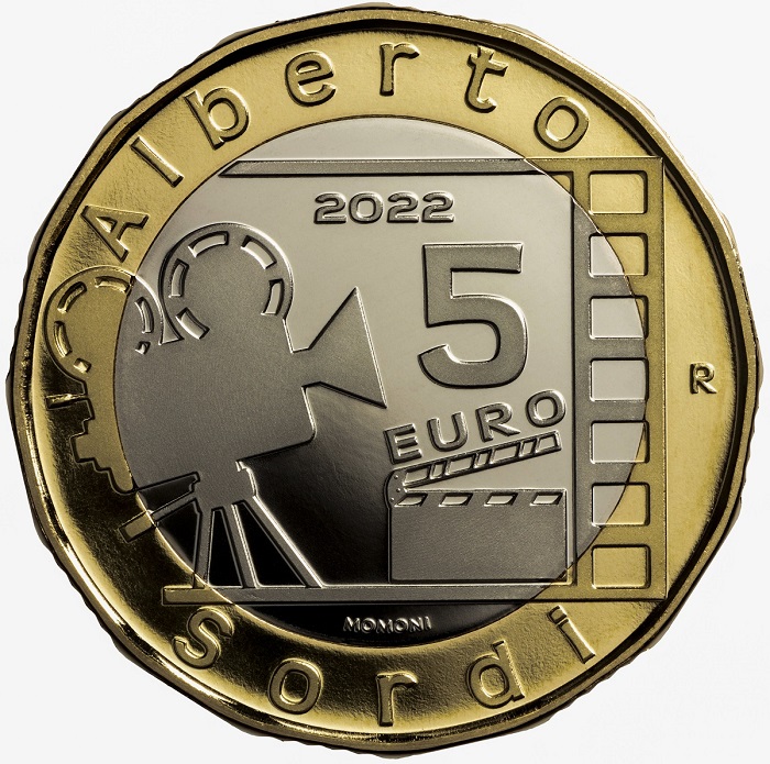 Stilizzata e lineare, moderna ed elegante, al rovescio la moneta da 5 euro in uscita il 20 luglio richiama una storica "pizza" da cinema