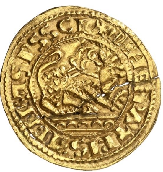 Al rovescio della moneta, uno dei rari "morabetinos" sul mercato, il leone araldico e in basso gli archi del ponte romano di Salamanca