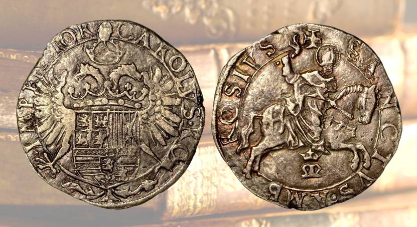 E' estremamente rara la berligna milanese coniata da Carlo V d'Asburgo (1535-1556) con al D/ aquila bicipite con corona imperiale e caricata dello stemma di Spagna e al R/ sant’Ambrogio a cavallo, con lo staffile nella mano destra