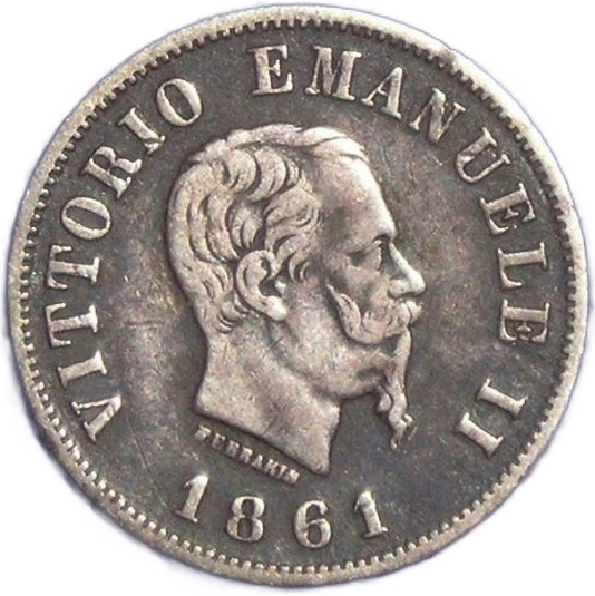 La data 1861 e il profilo di Vittorio Emanuele II già ci riportano all'alba della Nazione italiana e questa mezza lira segna un momento storico, quello dell'assunzione ufficiale della corona d'Italia da parte dei Savoia
